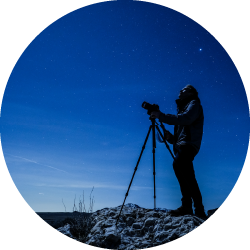 Man taking photos of the night sky on antelope island.